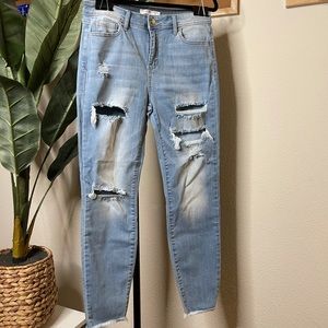 Light denim distressed skinny jeans